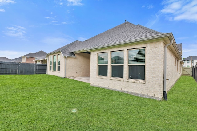 10021 Preserve Way, Conroe, TX 77385 - rear view of house with brick siding and a shingled roof