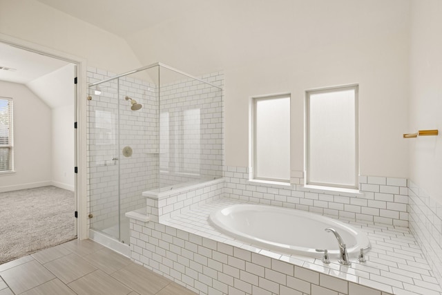10021 Preserve Way, Conroe, TX 77385 - bathroom with lofted ceiling, a garden tub, and a stall shower