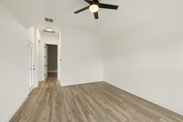 10021 Preserve Way, Conroe, TX 77385 - spare room featuring ceiling fan, light wood finished floors, baseboards, and vaulted ceiling