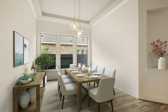 10021 Preserve Way, Conroe, TX 77385 - dining room featuring light wood-style flooring, a raised ceiling, and baseboards