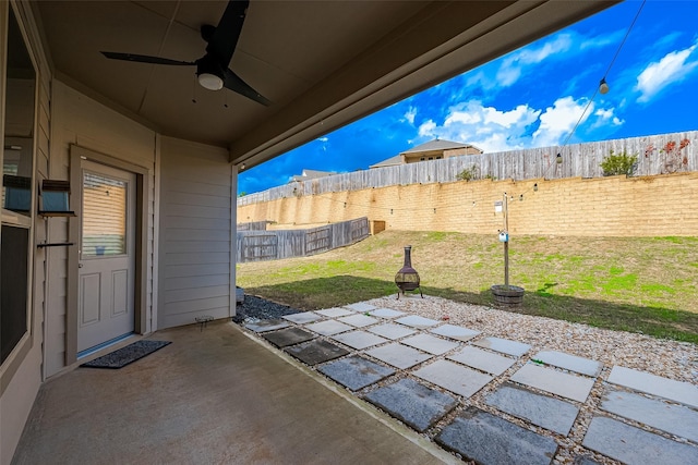 view of patio / terrace with a fenced backyard and ceiling fan