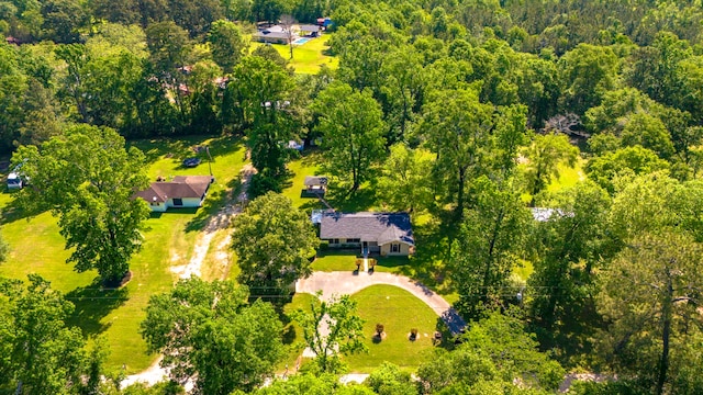 birds eye view of property featuring a wooded view