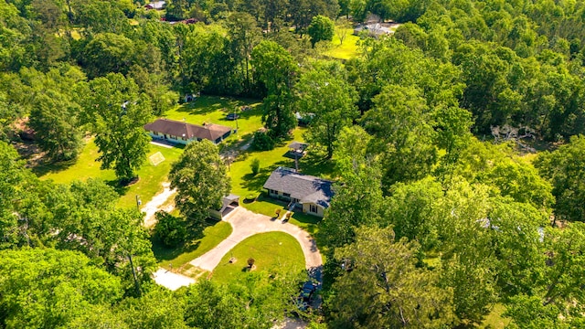 birds eye view of property with a wooded view