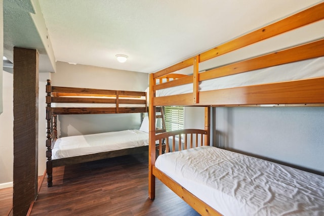 4211 San Jacinto Dr, Galveston, TX 77554 - bedroom with wood finished floors and baseboards
