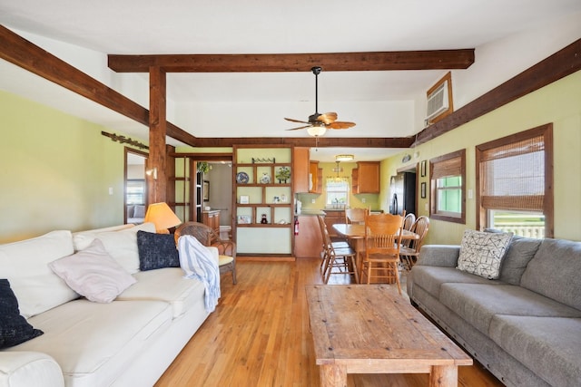 4211 San Jacinto Dr, Galveston, TX 77554 - living area with ceiling fan, beamed ceiling, and light wood-style flooring