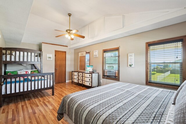 4211 San Jacinto Dr, Galveston, TX 77554 - bedroom featuring wood finished floors, lofted ceiling, and multiple windows