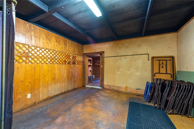 5606 S US Highway 77, Warda, TX 78960 - misc room with concrete flooring and wooden walls