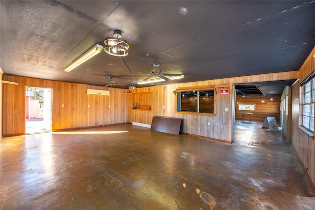 5606 S US Highway 77, Warda, TX 78960 - interior space with wooden walls, an AC wall unit, and a ceiling fan