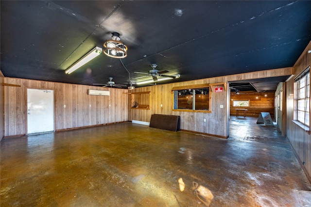 5606 S US Highway 77, Warda, TX 78960 - garage featuring wood walls, baseboards, and ceiling fan