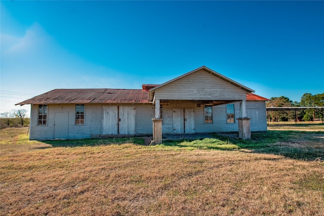 5606 S US Highway 77, Warda, TX 78960 - back of house featuring a lawn and a carport