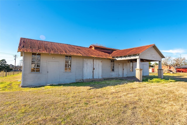 5606 S US Highway 77, Warda, TX 78960 - back of house with a lawn and metal roof