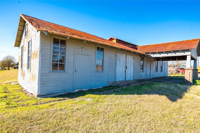 5606 S US Highway 77, Warda, TX 78960 - back of property featuring a lawn and metal roof