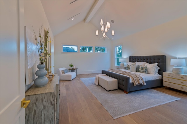 bedroom with lofted ceiling with beams, an inviting chandelier, wood finished floors, and baseboards
