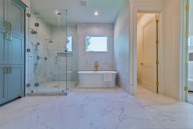 full bath with marble finish floor, a marble finish shower, a soaking tub, and visible vents