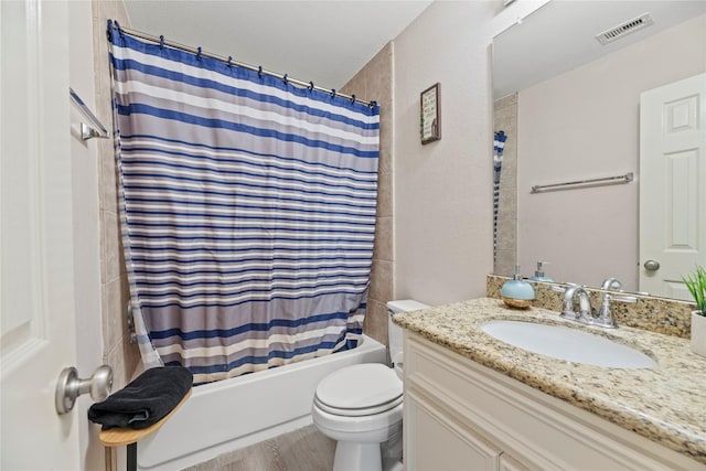 full bath featuring wood finished floors, vanity, shower / bath combination with curtain, toilet, and visible vents