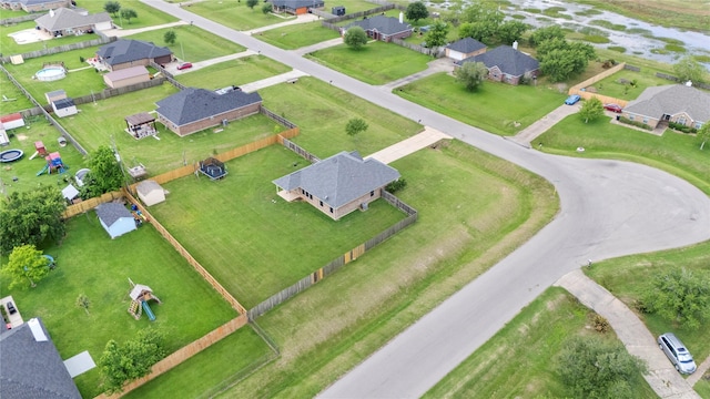 birds eye view of property with a residential view