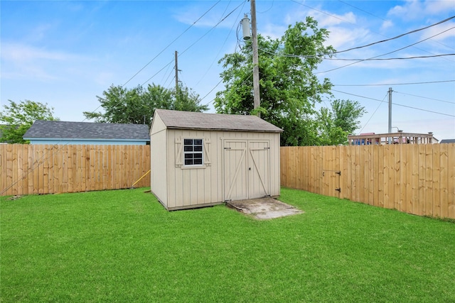 view of shed with a fenced backyard