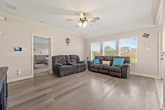 living room featuring a ceiling fan, crown molding, light wood finished floors, baseboards, and visible vents