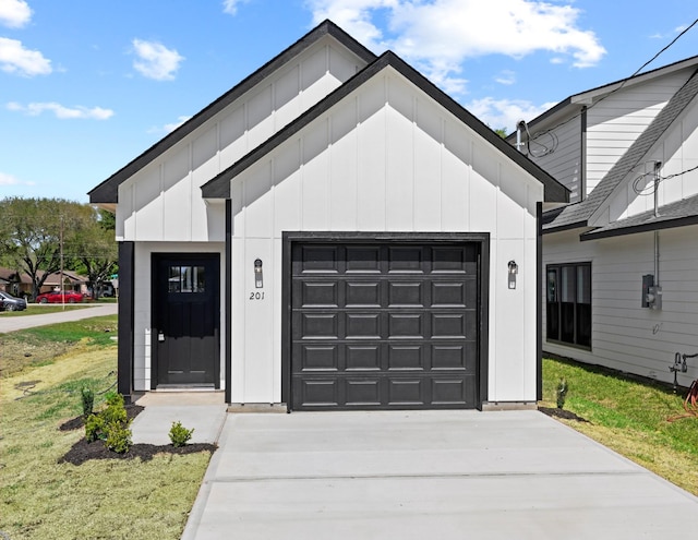 garage with concrete driveway