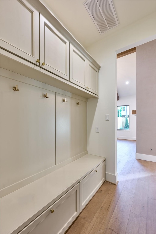 1570 Cheshire Ln, Houston, TX 77018 - mudroom with light wood-style flooring and baseboards