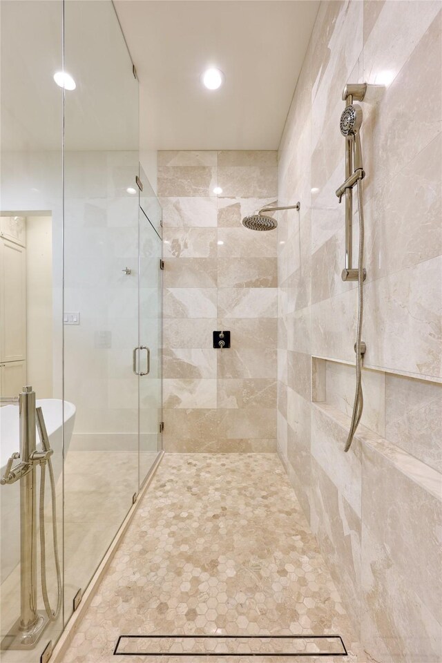 1570 Cheshire Ln, Houston, TX 77018 - bathroom featuring a shower stall, a freestanding bath, and recessed lighting