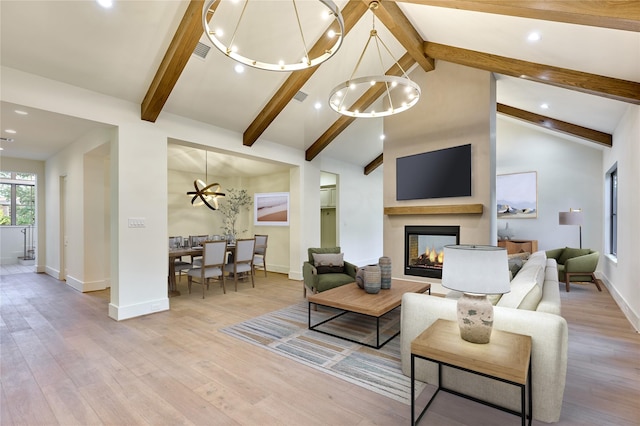 1570 Cheshire Ln, Houston, TX 77018 - living area with a chandelier, light wood-style flooring, a multi sided fireplace, beamed ceiling, and baseboards