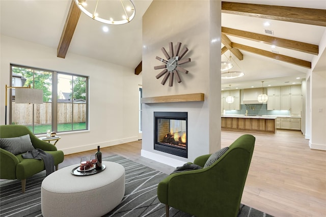 1570 Cheshire Ln, Houston, TX 77018 - living area featuring light wood-type flooring, beam ceiling, baseboards, high vaulted ceiling, and a multi sided fireplace