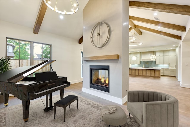 1570 Cheshire Ln, Houston, TX 77018 - sitting room with light wood-type flooring, beam ceiling, baseboards, recessed lighting, and a multi sided fireplace
