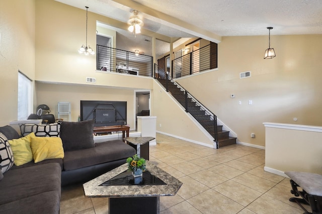 1858 Wood Orchard Dr, Missouri City, TX 77489 - tiled living room featuring visible vents, beamed ceiling, stairs, and high vaulted ceiling