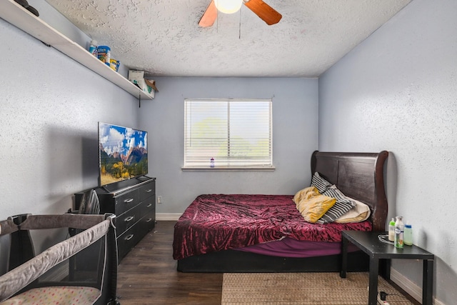 1858 Wood Orchard Dr, Missouri City, TX 77489 - bedroom featuring baseboards, wood finished floors, a ceiling fan, and a textured ceiling