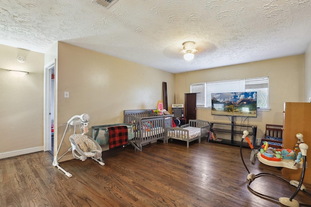 1858 Wood Orchard Dr, Missouri City, TX 77489 - bedroom with a textured ceiling, wood finished floors, ceiling fan, and baseboards