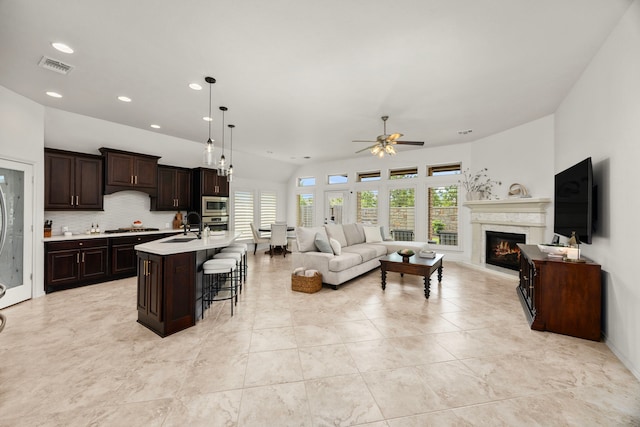 29119 Marina Point Ln, Fulshear, TX 77441 - living room with a ceiling fan, a fireplace, and recessed lighting