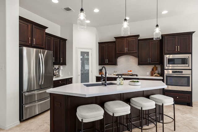 29119 Marina Point Ln, Fulshear, TX 77441 - kitchen with appliances with stainless steel finishes, a sink, light countertops, backsplash, and dark brown cabinets