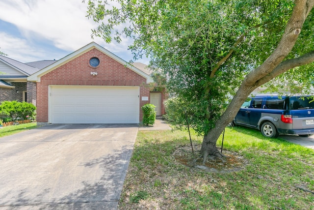 view of front of property featuring concrete driveway, an attached garage, and brick siding