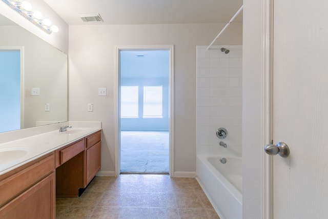 bathroom with a sink, double vanity, visible vents, tile patterned flooring, and washtub / shower combination