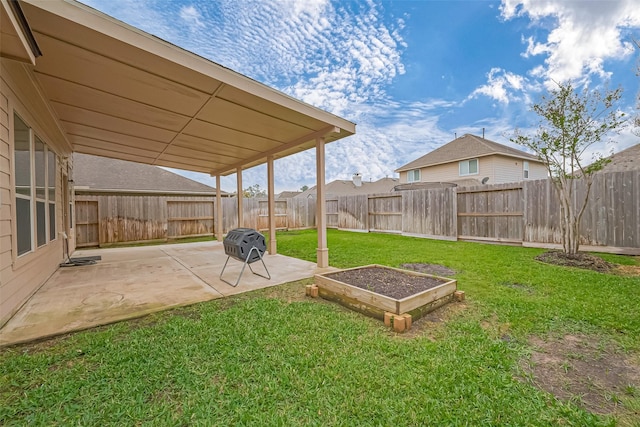 view of yard with a patio area and a fenced backyard