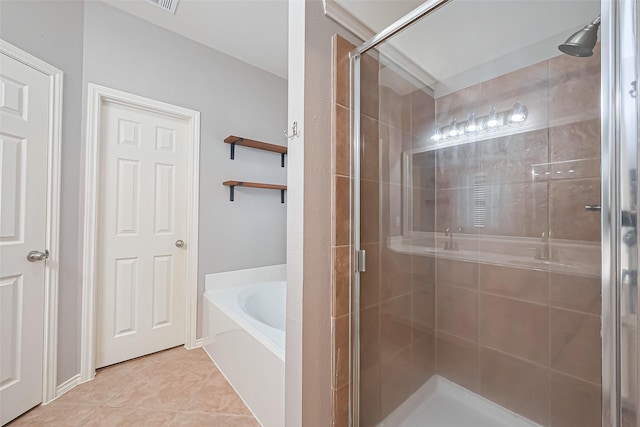 full bathroom with a shower stall, a garden tub, tile patterned floors, and visible vents
