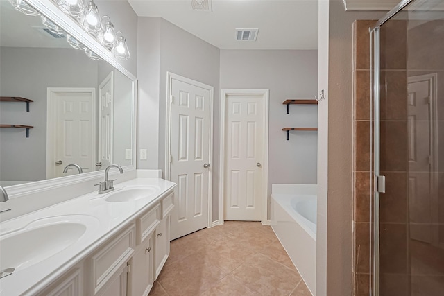 full bathroom with tile patterned flooring, visible vents, a sink, a garden tub, and a stall shower