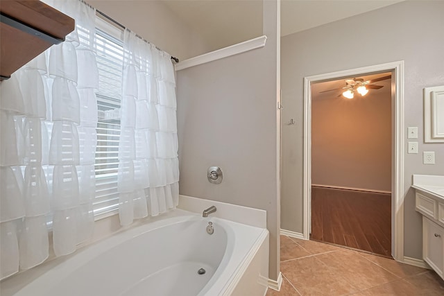 full bath featuring a bath, vanity, tile patterned flooring, and ceiling fan