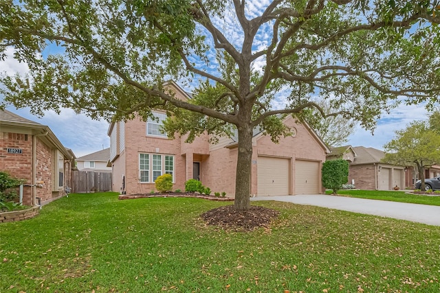 traditional-style house featuring concrete driveway, a front lawn, fence, and brick siding