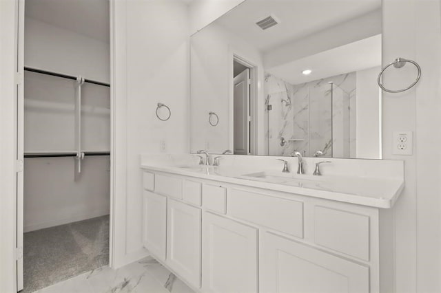 122 Canary Island Cir, Montgomery, TX 77316 - bathroom featuring a marble finish shower, a spacious closet, marble finish floors, and double vanity