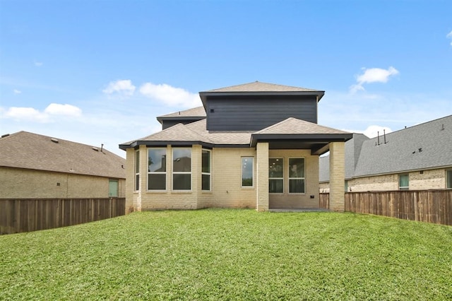 122 Canary Island Cir, Montgomery, TX 77316 - back of house featuring brick siding and roof with shingles