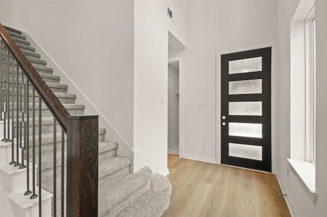 122 Canary Island Cir, Montgomery, TX 77316 - entrance foyer with stairs and light wood-style floors