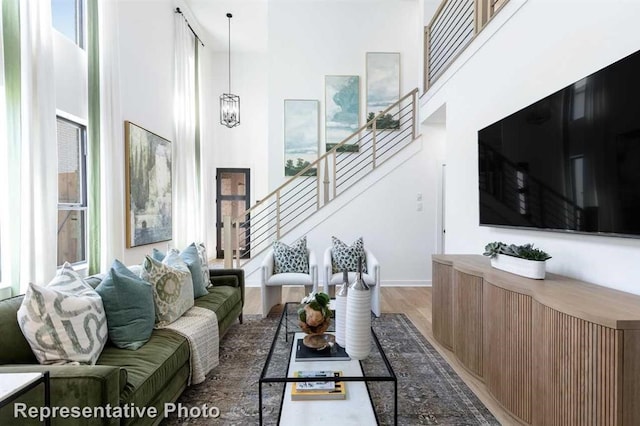 122 Canary Island Cir, Montgomery, TX 77316 - living area featuring a high ceiling, stairway, and wood finished floors