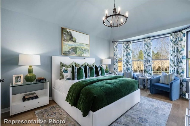 122 Canary Island Cir, Montgomery, TX 77316 - bedroom featuring a chandelier and wood finished floors