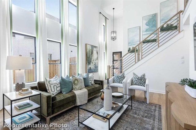 122 Canary Island Cir, Montgomery, TX 77316 - living area with a towering ceiling, stairway, and wood finished floors
