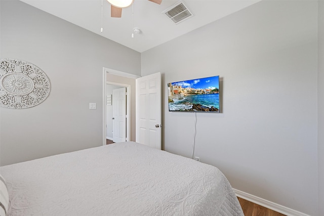16605 Flounder Way, Jamaica Beach, TX 77554 - bedroom with dark wood finished floors, baseboards, ceiling fan, and visible vents