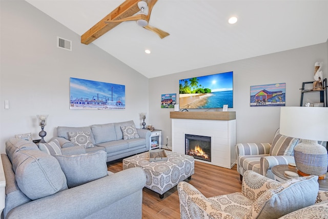 16605 Flounder Way, Jamaica Beach, TX 77554 - living room with recessed lighting, wood finished floors, visible vents, lofted ceiling with beams, and a glass covered fireplace