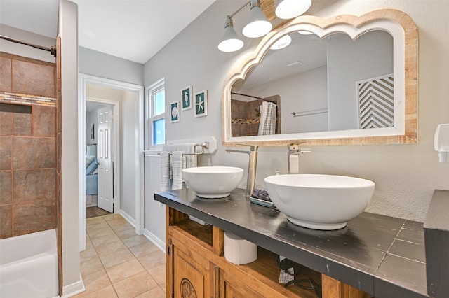 16605 Flounder Way, Jamaica Beach, TX 77554 - bathroom with tile patterned floors, a sink, and double vanity