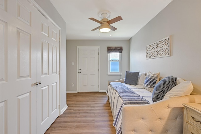 16605 Flounder Way, Jamaica Beach, TX 77554 - living area with a ceiling fan, baseboards, and light wood-style floors